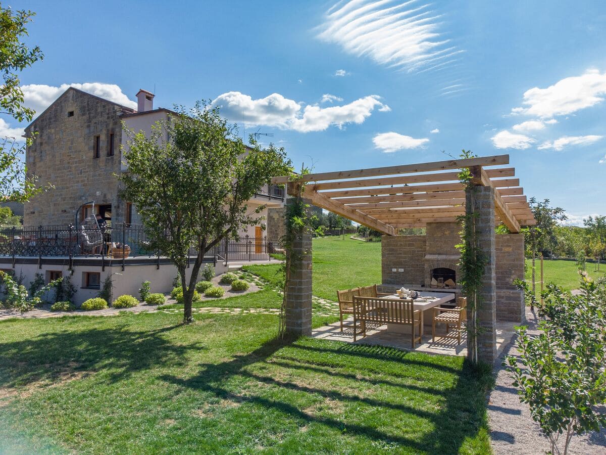 wide shot of a wood and stone building next to a w 2023 11 27 05 04 43 utc