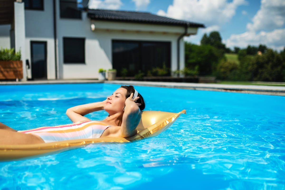 young woman in swimming pool outdoors in backyard 2023 11 27 05 20 24 utc